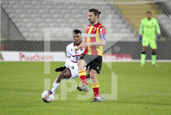 2021-01-23 - Yannick Cahuzac of Lens, William Saliba of Nice during the French championship Ligue 1 football match between RC Lens and OGC Nice on January 23, 2021 at stade Bollaert-Delelis in Lens, France - Photo Jean Catuffe / DPPI - RC LENS AND OGC NICE - FRENCH LIGUE 1 - SOCCER