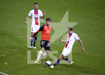 2021-01-31 - Adrian Grbic of Lorient between Thilo Kehrer and Angel Di Maria of PSG during the French championship Ligue 1 football match between FC Lorient and Paris Saint-Germain on January 31, 2021 at Stade du Moustoir - Yves Allainmat in Lorient, France - Photo Jean Catuffe / DPPI - FC LORIENT AND PARIS SAINT-GERMAIN - FRENCH LIGUE 1 - SOCCER
