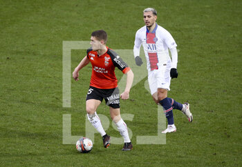 2021-01-31 - Julien Laporte of Lorient, Leandro Paredes of PSG during the French championship Ligue 1 football match between FC Lorient and Paris Saint-Germain on January 31, 2021 at Stade du Moustoir - Yves Allainmat in Lorient, France - Photo Jean Catuffe / DPPI - FC LORIENT AND PARIS SAINT-GERMAIN - FRENCH LIGUE 1 - SOCCER
