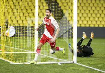 2021-01-31 - Guillermo Maripan of Monaco celebrates his goal while goalkeeper of Nantes Alban Lafont lies down during the French championship Ligue 1 football match between FC Nantes and AS Monaco on January 31, 2021 at Stade de La Beaujoire - Louis Fonteneau in Nantes, France - Photo Jean Catuffe / DPPI - FC NANTES AND AS MONACO - FRENCH LIGUE 1 - SOCCER