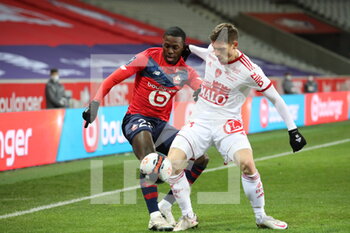 2021-02-14 - Duel WEAH 22 LOSC and HERELLE Christophe 23 Brest during the French championship Ligue 1 football match between Lille OSC and Stade Brestois 29 on February 14, 2021 at Pierre Mauroy stadium in Villeneuve-d'Ascq near Lille, France - Photo Laurent Sanson / LS Medianord / DPPI - LILLE OSC (LOSC) AND STADE BRESTOIS 29 (BREST) - FRENCH LIGUE 1 - SOCCER