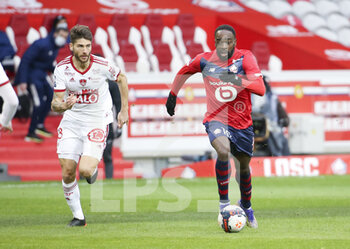 2021-02-14 - Jonathan Ikone of Lille, Paul Lasne of Brest (left) during the French championship Ligue 1 football match between Lille OSC (LOSC) and Stade Brestois 29 (Brest) on February 14, 2021 at Stade Pierre Mauroy in Villeneuve-d'Ascq near Lille, France - Photo Jean Catuffe / DPPI - LILLE OSC (LOSC) AND STADE BRESTOIS 29 (BREST) - FRENCH LIGUE 1 - SOCCER
