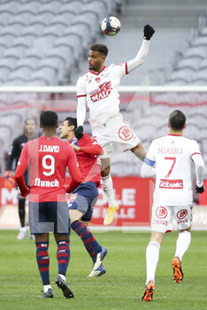 2021-02-14 - Steve Mounie of Brest, Benjamin Andre of Lille (left) during the French championship Ligue 1 football match between Lille OSC (LOSC) and Stade Brestois 29 (Brest) on February 14, 2021 at Stade Pierre Mauroy in Villeneuve-d'Ascq near Lille, France - Photo Jean Catuffe / DPPI - LILLE OSC (LOSC) AND STADE BRESTOIS 29 (BREST) - FRENCH LIGUE 1 - SOCCER