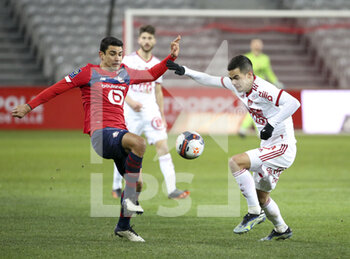 2021-02-14 - Benjamin Andre of Lille, Romain Faivre of Brest during the French championship Ligue 1 football match between Lille OSC (LOSC) and Stade Brestois 29 (Brest) on February 14, 2021 at Stade Pierre Mauroy in Villeneuve-d'Ascq near Lille, France - Photo Jean Catuffe / DPPI - LILLE OSC (LOSC) AND STADE BRESTOIS 29 (BREST) - FRENCH LIGUE 1 - SOCCER