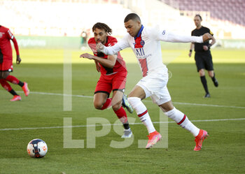 2021-02-27 - Kylian Mbappe of PSG, Sacha Boey of Dijon (left) during the French championship Ligue 1 football match between Dijon FCO (DFCO) and Paris Saint-Germain (PSG) on February 27, 2021 at Stade Gaston Gerard in Dijon, France - Photo Jean Catuffe / DPPI - DIJON FCO (DFCO) AND PARIS SAINT-GERMAIN (PSG) - FRENCH LIGUE 1 - SOCCER