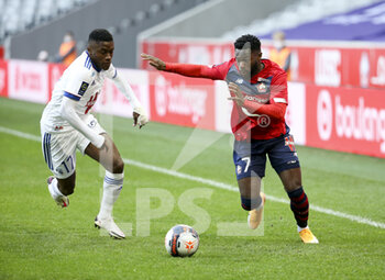 2021-02-28 - Jonathan Bamba of Lille, Jean-Ricner Bellegarde of Strasbourg (left) during the French championship Ligue 1 football match between Lille OSC and RC Strasbourg on february 28, 2021 at Pierre Mauroy stadium in Villeneuve-d'Ascq near Lille, France - Photo Jean Catuffe / DPPI - LILLE OSC AND RC STRASBOURG - FRENCH LIGUE 1 - SOCCER