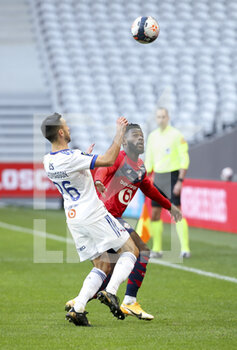2021-02-28 - Jonathan Bamba of Lille, Adrien Thomasson of Strasbourg (left) during the French championship Ligue 1 football match between Lille OSC and RC Strasbourg on february 28, 2021 at Pierre Mauroy stadium in Villeneuve-d'Ascq near Lille, France - Photo Jean Catuffe / DPPI - LILLE OSC AND RC STRASBOURG - FRENCH LIGUE 1 - SOCCER