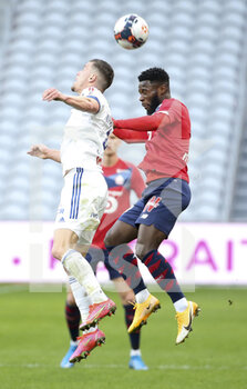 2021-02-28 - Jonathan Bamba of Lille, Frederic Guilbert of Strasbourg (left) during the French championship Ligue 1 football match between Lille OSC and RC Strasbourg on february 28, 2021 at Pierre Mauroy stadium in Villeneuve-d'Ascq near Lille, France - Photo Jean Catuffe / DPPI - LILLE OSC AND RC STRASBOURG - FRENCH LIGUE 1 - SOCCER