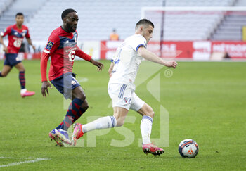 2021-02-28 - Frederic Guilbert of Strasbourg, Jonathan Ikone of Lille (left) during the French championship Ligue 1 football match between Lille OSC and RC Strasbourg on february 28, 2021 at Pierre Mauroy stadium in Villeneuve-d'Ascq near Lille, France - Photo Jean Catuffe / DPPI - LILLE OSC AND RC STRASBOURG - FRENCH LIGUE 1 - SOCCER