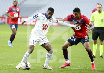 2021-02-28 - Jean-Ricner Bellegarde of Strasbourg, Reinildo Mandava of Lille during the French championship Ligue 1 football match between Lille OSC and RC Strasbourg on february 28, 2021 at Pierre Mauroy stadium in Villeneuve-d'Ascq near Lille, France - Photo Jean Catuffe / DPPI - LILLE OSC AND RC STRASBOURG - FRENCH LIGUE 1 - SOCCER