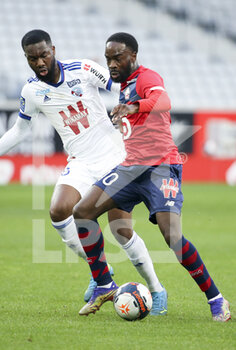 2021-02-28 - Jonathan Ikone of Lille, Jean-Eudes Aholou of Strasbourg (left) during the French championship Ligue 1 football match between Lille OSC and RC Strasbourg on february 28, 2021 at Pierre Mauroy stadium in Villeneuve-d'Ascq near Lille, France - Photo Jean Catuffe / DPPI - LILLE OSC AND RC STRASBOURG - FRENCH LIGUE 1 - SOCCER