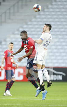2021-02-28 - Boubakary Soumare of Lille, Adrien Thomasson of Strasbourg during the French championship Ligue 1 football match between Lille OSC and RC Strasbourg on february 28, 2021 at Pierre Mauroy stadium in Villeneuve-d'Ascq near Lille, France - Photo Jean Catuffe / DPPI - LILLE OSC AND RC STRASBOURG - FRENCH LIGUE 1 - SOCCER