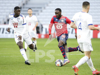 2021-02-28 - Jonathan Ikone of Lille, Ibrahima Sissoko of Strasbourg (left) during the French championship Ligue 1 football match between Lille OSC and RC Strasbourg on february 28, 2021 at Pierre Mauroy stadium in Villeneuve-d'Ascq near Lille, France - Photo Jean Catuffe / DPPI - LILLE OSC AND RC STRASBOURG - FRENCH LIGUE 1 - SOCCER