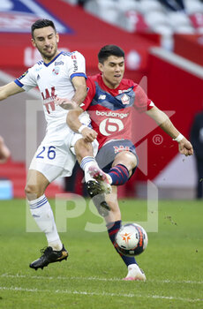 2021-02-28 - Luiz Araujo of Lille, Adrien Thomasson of Strasbourg (left) during the French championship Ligue 1 football match between Lille OSC and RC Strasbourg on february 28, 2021 at Pierre Mauroy stadium in Villeneuve-d'Ascq near Lille, France - Photo Jean Catuffe / DPPI - LILLE OSC AND RC STRASBOURG - FRENCH LIGUE 1 - SOCCER