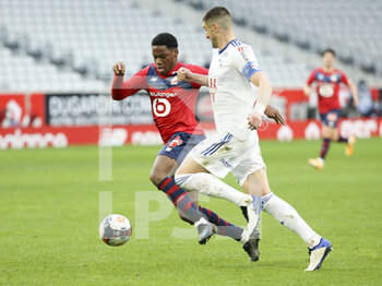 2021-02-28 - Jonathan David of Lille, Stefan Mitrovic of Strasbourg during the French championship Ligue 1 football match between Lille OSC and RC Strasbourg on february 28, 2021 at Pierre Mauroy stadium in Villeneuve-d'Ascq near Lille, France - Photo Jean Catuffe / DPPI - LILLE OSC AND RC STRASBOURG - FRENCH LIGUE 1 - SOCCER
