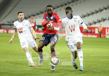 2021-02-28 - Jonathan Ikone of Lille, Jean-Eudes Aholou of Strasbourg during the French championship Ligue 1 football match between Lille OSC and RC Strasbourg on february 28, 2021 at Pierre Mauroy stadium in Villeneuve-d'Ascq near Lille, France - Photo Jean Catuffe / DPPI - LILLE OSC AND RC STRASBOURG - FRENCH LIGUE 1 - SOCCER