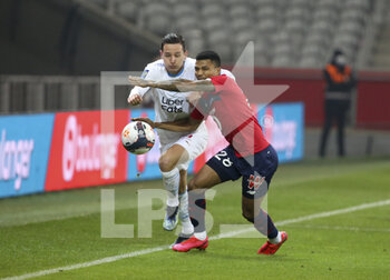 2021-03-03 - Florian Thauvin of Marseille, Reinildo Mandava of Lille during the French championship Ligue 1 football match between Lille OSC and Olympique de Marseille on March 3, 2021 at Pierre Mauroy stadium in Villeneuve-d'Ascq near Lille, France - Photo Jean Catuffe / DPPI - LILLE OSC AND OLYMPIQUE DE MARSEILLE - FRENCH LIGUE 1 - SOCCER