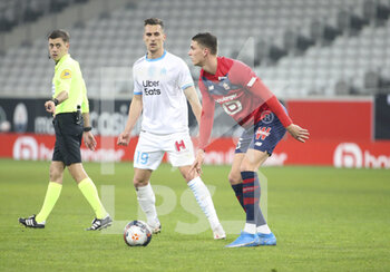 2021-03-03 - Sven Botman of Lille, Arkadiusz Milik of Marseille (left) during the French championship Ligue 1 football match between Lille OSC and Olympique de Marseille on March 3, 2021 at Pierre Mauroy stadium in Villeneuve-d'Ascq near Lille, France - Photo Jean Catuffe / DPPI - LILLE OSC AND OLYMPIQUE DE MARSEILLE - FRENCH LIGUE 1 - SOCCER
