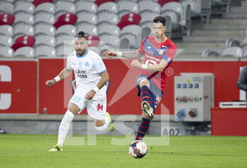 2021-03-03 - Jose Fonte of Lille, Dimitri Payet of Marseille (left) during the French championship Ligue 1 football match between Lille OSC and Olympique de Marseille on March 3, 2021 at Pierre Mauroy stadium in Villeneuve-d'Ascq near Lille, France - Photo Jean Catuffe / DPPI - LILLE OSC AND OLYMPIQUE DE MARSEILLE - FRENCH LIGUE 1 - SOCCER