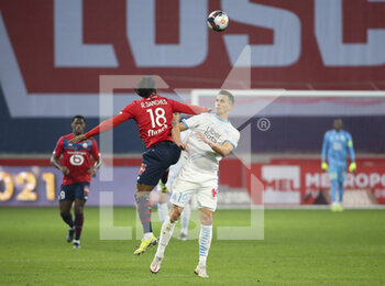 2021-03-03 - Arkadiusz Milik of Marseille, Renato Sanches of Lille (left) during the French championship Ligue 1 football match between Lille OSC and Olympique de Marseille on March 3, 2021 at Pierre Mauroy stadium in Villeneuve-d'Ascq near Lille, France - Photo Jean Catuffe / DPPI - LILLE OSC AND OLYMPIQUE DE MARSEILLE - FRENCH LIGUE 1 - SOCCER