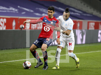 2021-03-03 - Benjamin Andre of Lille, Dimitri Payet of Marseille during the French championship Ligue 1 football match between Lille OSC and Olympique de Marseille on March 3, 2021 at Pierre Mauroy stadium in Villeneuve-d'Ascq near Lille, France - Photo Jean Catuffe / DPPI - LILLE OSC AND OLYMPIQUE DE MARSEILLE - FRENCH LIGUE 1 - SOCCER