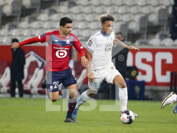 2021-03-03 - Boubacar Kamara of Marseille, Benjamin Andre of Lille (left) during the French championship Ligue 1 football match between Lille OSC and Olympique de Marseille on March 3, 2021 at Pierre Mauroy stadium in Villeneuve-d'Ascq near Lille, France - Photo Jean Catuffe / DPPI - LILLE OSC AND OLYMPIQUE DE MARSEILLE - FRENCH LIGUE 1 - SOCCER