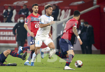 2021-03-03 - Boubacar Kamara of Marseille, Mehmet Zeki Celik of Lille (left) during the French championship Ligue 1 football match between Lille OSC and Olympique de Marseille on March 3, 2021 at Pierre Mauroy stadium in Villeneuve-d'Ascq near Lille, France - Photo Jean Catuffe / DPPI - LILLE OSC AND OLYMPIQUE DE MARSEILLE - FRENCH LIGUE 1 - SOCCER
