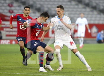 2021-03-03 - Arkadiusz Milik of Marseille, left Jose Fonte, Benjamin Andre of Lille during the French championship Ligue 1 football match between Lille OSC and Olympique de Marseille on March 3, 2021 at Pierre Mauroy stadium in Villeneuve-d'Ascq near Lille, France - Photo Jean Catuffe / DPPI - LILLE OSC AND OLYMPIQUE DE MARSEILLE - FRENCH LIGUE 1 - SOCCER