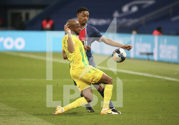 2021-03-14 - Marcus Coco of FC Nantes, Abdou Diallo of PSG during the French championship Ligue 1 football match between Paris Saint-Germain and FC Nantes on March 14, 2021 at Parc des Princes stadium in Paris, France - Photo Jean Catuffe / DPPI - PARIS SAINT-GERMAIN AND FC NANTES - FRENCH LIGUE 1 - SOCCER