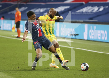 2021-03-14 - Abdou Diallo of PSG, Marcus Coco of FC Nantes during the French championship Ligue 1 football match between Paris Saint-Germain and FC Nantes on March 14, 2021 at Parc des Princes stadium in Paris, France - Photo Jean Catuffe / DPPI - PARIS SAINT-GERMAIN AND FC NANTES - FRENCH LIGUE 1 - SOCCER
