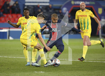 2021-03-14 - Rafael Alcantara aka Rafinha of PSG, left Andrei Girotto, Charles Traore of FC Nantes, right Nicolas Pallois of FC Nantes during the French championship Ligue 1 football match between Paris Saint-Germain and FC Nantes on March 14, 2021 at Parc des Princes stadium in Paris, France - Photo Jean Catuffe / DPPI - PARIS SAINT-GERMAIN AND FC NANTES - FRENCH LIGUE 1 - SOCCER