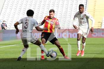2021-03-14 - Duel Jonathan Clauss 11 Lens and Matthieu Udol 3 Metz during the French championship Ligue 1 football match between RC Lens and FC Metz on March 14, 2021 at Bollaert-Delelis stadium in Lens, France - Photo Laurent Sanson / LS Medianord / DPPI - RC LENS AND FC METZ - FRENCH LIGUE 1 - SOCCER