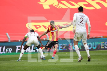 2021-03-14 - Florian Sotoca 7 Lens and John Boye 21 Metz during the French championship Ligue 1 football match between RC Lens and FC Metz on March 14, 2021 at Bollaert-Delelis stadium in Lens, France - Photo Laurent Sanson / LS Medianord / DPPI - RC LENS AND FC METZ - FRENCH LIGUE 1 - SOCCER