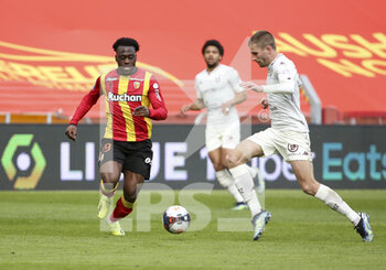 2021-03-14 - Arnaud Kalimuendo of Lens, Thomas Delaine of FC Metz during the French championship Ligue 1 football match between RC Lens and FC Metz on March 14, 2021 at Stade Bollaert-Delelis in Lens, France - Photo Jean Catuffe / DPPI - RC LENS AND FC METZ - FRENCH LIGUE 1 - SOCCER