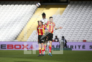 2021-03-14 - Yannick Cahuzac of Lens, Florian Sotoca of Lens, John Boye of FC Metz during the French championship Ligue 1 football match between RC Lens and FC Metz on March 14, 2021 at Stade Bollaert-Delelis in Lens, France - Photo Jean Catuffe / DPPI - RC LENS AND FC METZ - FRENCH LIGUE 1 - SOCCER