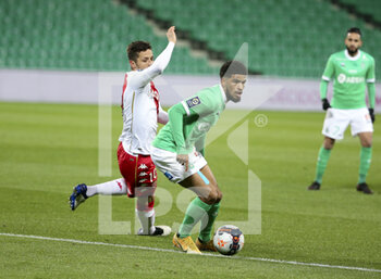 2021-03-19 - Mahdi Camara of Saint-Etienne, Stevan Jovetic of Monaco (left) during the French championship Ligue 1 football match between AS Saint-Etienne (ASSE) and AS Monaco (ASM) on March 19, 2021 at Stade Geoffroy Guichard in Saint-Etienne, France - Photo Jean Catuffe / DPPI - AS SAINT-ETIENNE (ASSE) AND AS MONACO (ASM) - FRENCH LIGUE 1 - SOCCER