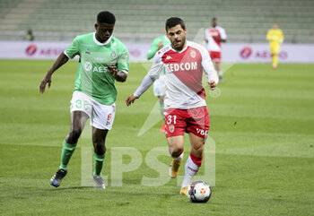 2021-03-19 - Kevin Volland of Monaco, Saidou Sow of Saint-Etienne (left) during the French championship Ligue 1 football match between AS Saint-Etienne (ASSE) and AS Monaco (ASM) on March 19, 2021 at Stade Geoffroy Guichard in Saint-Etienne, France - Photo Jean Catuffe / DPPI - AS SAINT-ETIENNE (ASSE) AND AS MONACO (ASM) - FRENCH LIGUE 1 - SOCCER