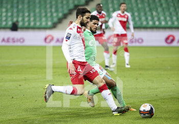 2021-03-19 - Cesc Fabregas of Monaco, Mahdi Camara of Saint-Etienne during the French championship Ligue 1 football match between AS Saint-Etienne (ASSE) and AS Monaco (ASM) on March 19, 2021 at Stade Geoffroy Guichard in Saint-Etienne, France - Photo Jean Catuffe / DPPI - AS SAINT-ETIENNE (ASSE) AND AS MONACO (ASM) - FRENCH LIGUE 1 - SOCCER