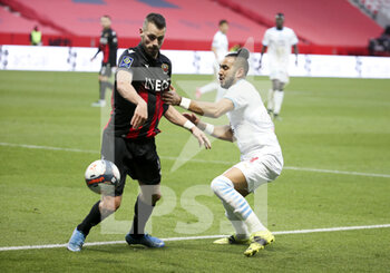 2021-03-20 - Morgan Schneiderlin of Nice, Dimitri Payet of Marseille during the French championship Ligue 1 football match between OGC Nice and Olympique de Marseille (OM) on March 20, 2021 at Allianz Riviera stadium in Nice, France - Photo Jean Catuffe / DPPI - OGC NICE AND OLYMPIQUE DE MARSEILLE (OM) - FRENCH LIGUE 1 - SOCCER