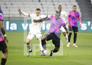 2021-03-21 - Moise Kean of PSG, Maxence Caqueret of Lyon (left) during the French championship Ligue 1 football match between Olympique Lyonnais and Paris Saint-Germain on March 21, 2021 at Groupama stadium in Decines-Charpieu near Lyon, France - Photo Jean Catuffe / DPPI - OLYMPIQUE LYONNAIS AND PARIS SAINT-GERMAIN - FRENCH LIGUE 1 - SOCCER
