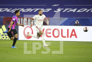 2021-03-21 - Memphis Depay of Lyon, Marquinhos of PSG (left) during the French championship Ligue 1 football match between Olympique Lyonnais (OL) and Paris Saint-Germain (PSG) on March 21, 2021 at Groupama stadium in Decines-Charpieu near Lyon, France - Photo Jean Catuffe / DPPI - OLYMPIQUE LYONNAIS AND PARIS SAINT-GERMAIN - FRENCH LIGUE 1 - SOCCER