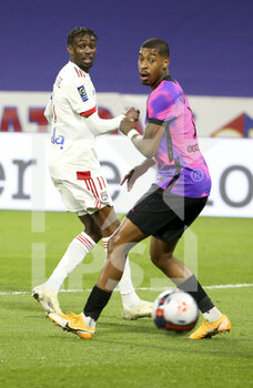 2021-03-21 - Tino Kadewere of Lyon, Presnel Kimpembe of PSG during the French championship Ligue 1 football match between Olympique Lyonnais (OL) and Paris Saint-Germain (PSG) on March 21, 2021 at Groupama stadium in Decines-Charpieu near Lyon, France - Photo Jean Catuffe / DPPI - OLYMPIQUE LYONNAIS AND PARIS SAINT-GERMAIN - FRENCH LIGUE 1 - SOCCER