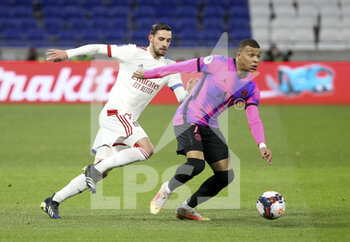 2021-03-21 - Kylian Mbappe of PSG, Mattia de Sciglio of Lyon (left) during the French championship Ligue 1 football match between Olympique Lyonnais (OL) and Paris Saint-Germain (PSG) on March 21, 2021 at Groupama stadium in Decines-Charpieu near Lyon, France - Photo Jean Catuffe / DPPI - OLYMPIQUE LYONNAIS AND PARIS SAINT-GERMAIN - FRENCH LIGUE 1 - SOCCER