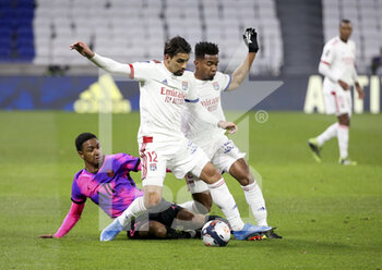 2021-03-21 - Lucas Paqueta, Thiago Mendes of Lyon, Abdou Diallo of PSG (left) during the French championship Ligue 1 football match between Olympique Lyonnais (OL) and Paris Saint-Germain (PSG) on March 21, 2021 at Groupama stadium in Decines-Charpieu near Lyon, France - Photo Jean Catuffe / DPPI - OLYMPIQUE LYONNAIS AND PARIS SAINT-GERMAIN - FRENCH LIGUE 1 - SOCCER