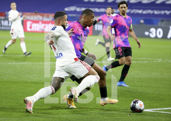 2021-03-21 - Memphis Depay of Lyon, Presnel Kimpembe of PSG during the French championship Ligue 1 football match between Olympique Lyonnais (OL) and Paris Saint-Germain (PSG) on March 21, 2021 at Groupama stadium in Decines-Charpieu near Lyon, France - Photo Jean Catuffe / DPPI - OLYMPIQUE LYONNAIS AND PARIS SAINT-GERMAIN - FRENCH LIGUE 1 - SOCCER