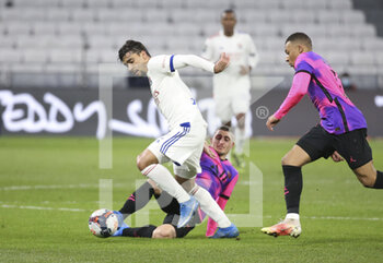 2021-03-21 - Lucas Paqueta of Lyon, Marco Verratti, Kylian Mbappe of PSG during the French championship Ligue 1 football match between Olympique Lyonnais (OL) and Paris Saint-Germain (PSG) on March 21, 2021 at Groupama stadium in Decines-Charpieu near Lyon, France - Photo Jean Catuffe / DPPI - OLYMPIQUE LYONNAIS AND PARIS SAINT-GERMAIN - FRENCH LIGUE 1 - SOCCER
