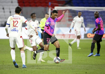 2021-03-21 - Abdou Diallo of PSG, Tino Kadewere of Lyon (left) during the French championship Ligue 1 football match between Olympique Lyonnais (OL) and Paris Saint-Germain (PSG) on March 21, 2021 at Groupama stadium in Decines-Charpieu near Lyon, France - Photo Jean Catuffe / DPPI - OLYMPIQUE LYONNAIS AND PARIS SAINT-GERMAIN - FRENCH LIGUE 1 - SOCCER