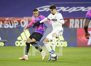 2021-03-21 - Kylian Mbappe of PSG, Lucas Paqueta of Lyon during the French championship Ligue 1 football match between Olympique Lyonnais (OL) and Paris Saint-Germain (PSG) on March 21, 2021 at Groupama stadium in Decines-Charpieu near Lyon, France - Photo Jean Catuffe / DPPI - OLYMPIQUE LYONNAIS AND PARIS SAINT-GERMAIN - FRENCH LIGUE 1 - SOCCER