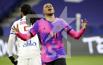 2021-03-21 - Kylian Mbappe of PSG reacts after missing a goal during the French championship Ligue 1 football match between Olympique Lyonnais (OL) and Paris Saint-Germain (PSG) on March 21, 2021 at Groupama stadium in Decines-Charpieu near Lyon, France - Photo Jean Catuffe / DPPI - OLYMPIQUE LYONNAIS AND PARIS SAINT-GERMAIN - FRENCH LIGUE 1 - SOCCER