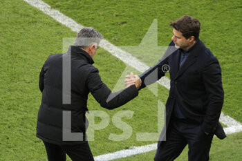 2021-04-03 - Christophe GALTIER (Lille OSC) won the game and greeted Mauricio POCHETTINO (PSG) at the end of the game during the French championship Ligue 1 football match between Paris Saint-Germain and LOSC Lille on April 3, 2021 at Parc des Princes stadium in Paris, France - Photo Stephane Allaman / DPPI - PARIS SAINT-GERMAIN AND LOSC LILLE - FRENCH LIGUE 1 - SOCCER